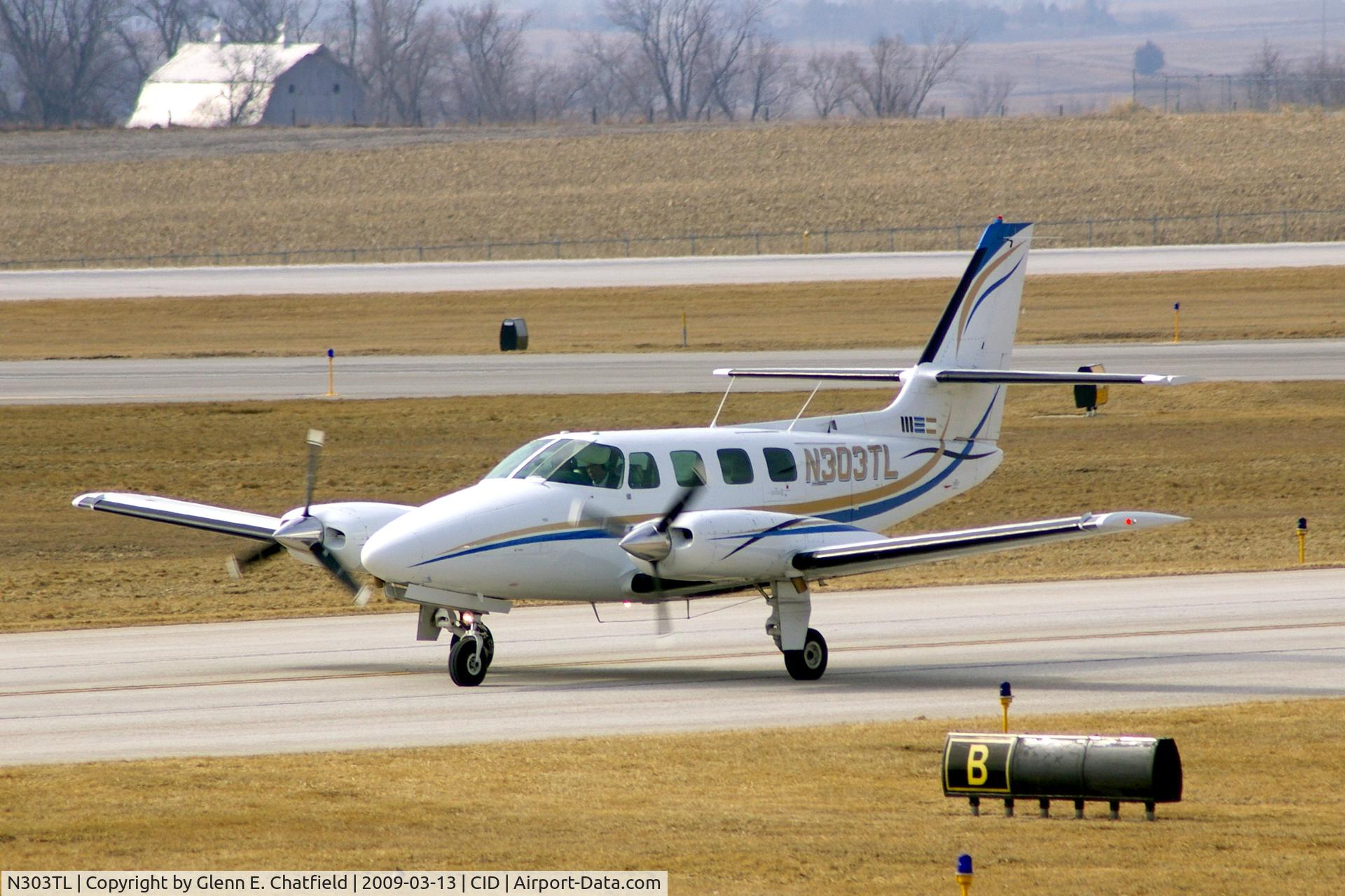 N303TL, 1984 Cessna T303 Crusader C/N T30300286, On Bravo taxiway after landing runway 13, heading for Landmark FBO