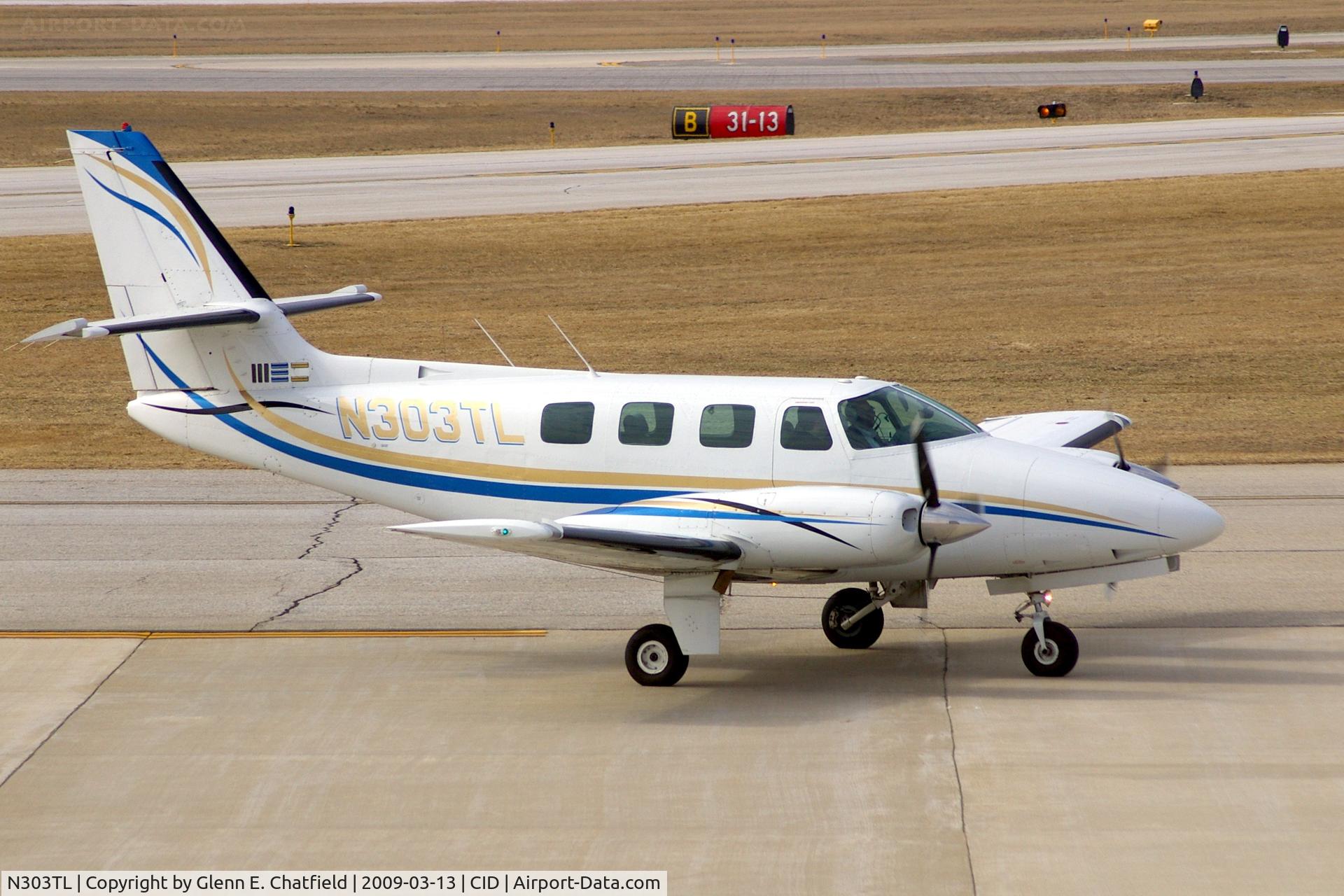 N303TL, 1984 Cessna T303 Crusader C/N T30300286, Taxiing by my window on the way to Landmark Aviation
