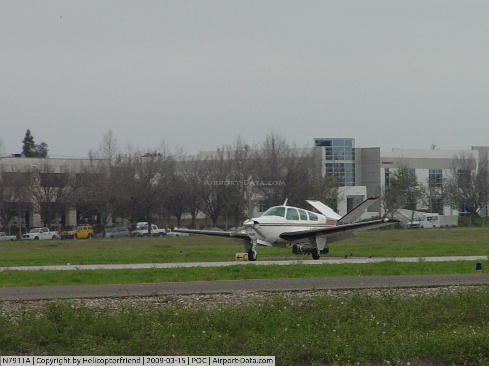 N7911A, 1964 Beech S35 Bonanza C/N D-7490, Touching down at Brackett