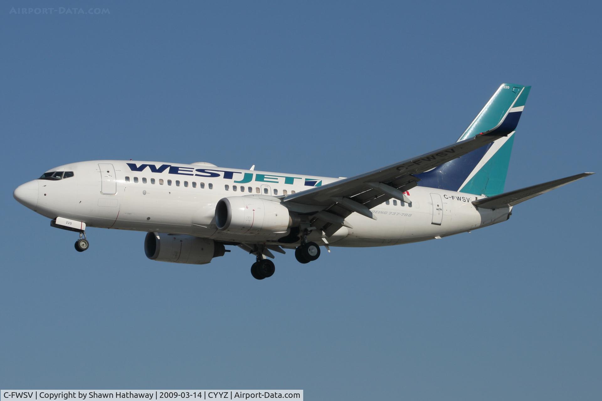 C-FWSV, 2003 Boeing 737-7CT C/N 32760, Landing Runway 33R