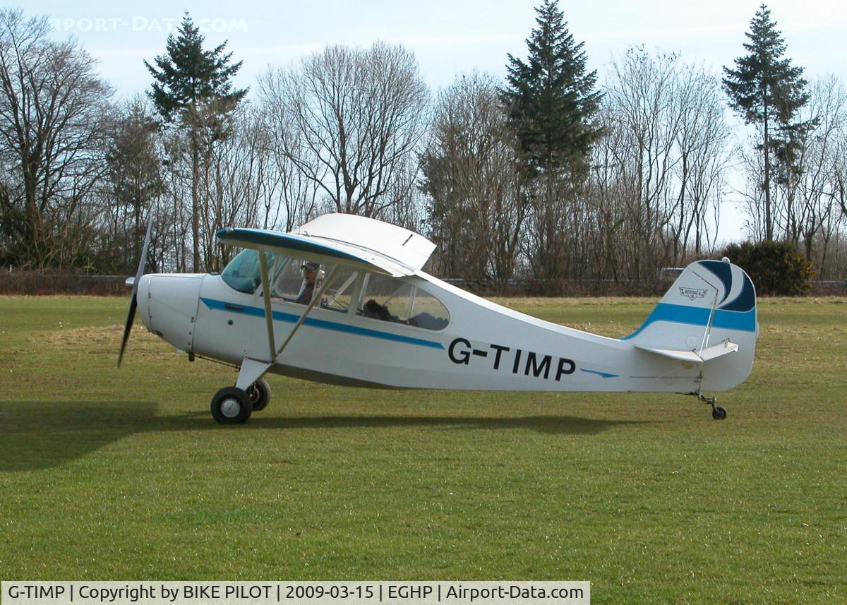 G-TIMP, 1946 Aeronca 7BCM C/N 7AC-3392, NICE LOOKING AERONCA TAXYING PAST THE CLUBHOUSE
