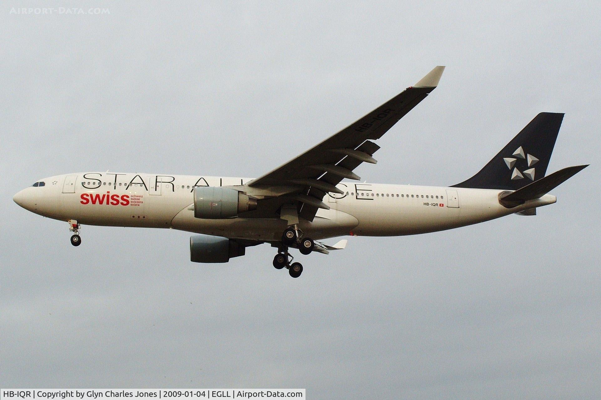 HB-IQR, 2000 Airbus A330-223 C/N 324, Star Alliance scheme. On finals to runway 27L. Previously D-AIME, OO-SFU and test registration F-WWYU. Not so common at Heathrow these days. Operated by Swiss International Air Lines.