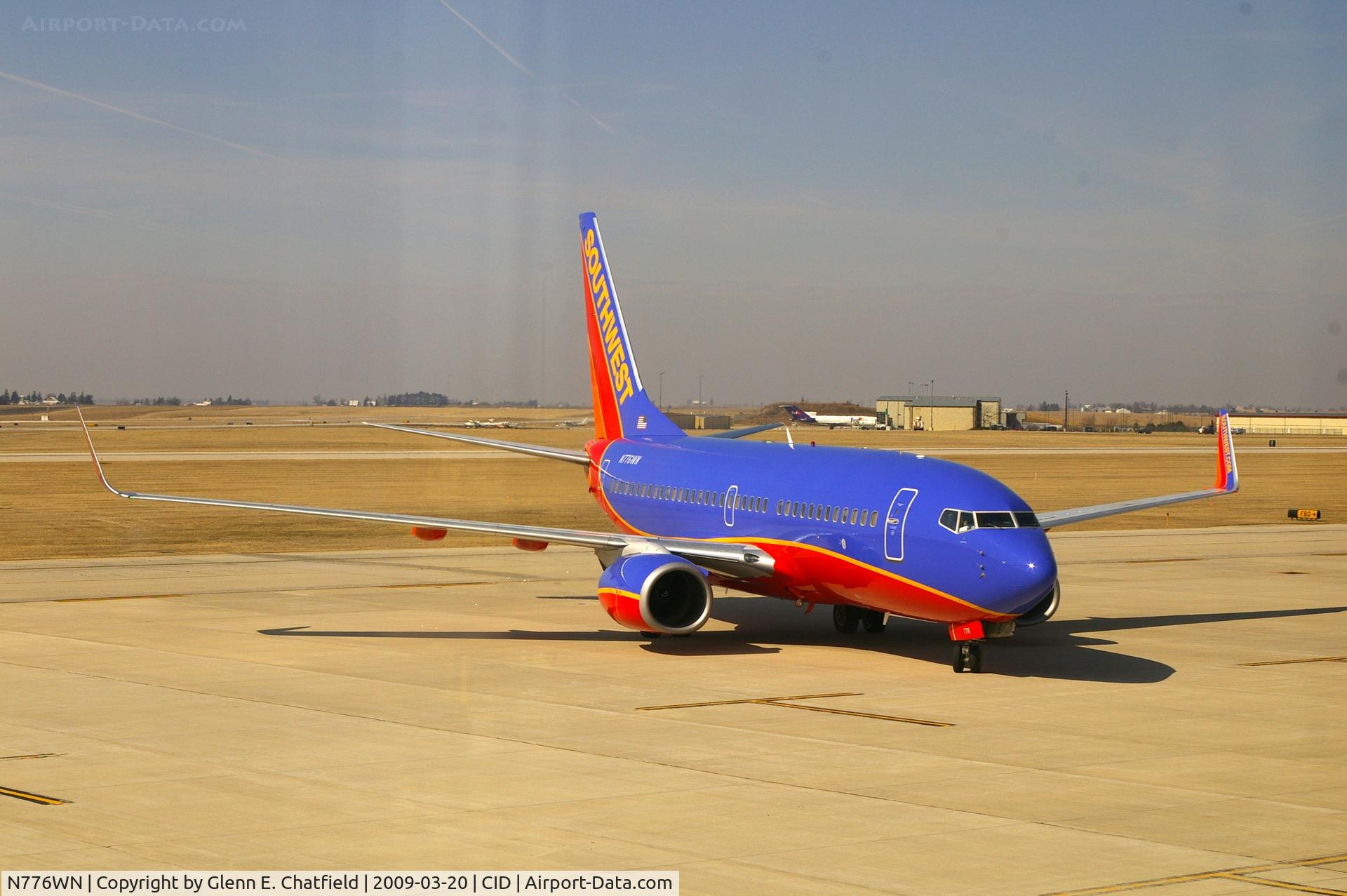 N776WN, 2000 Boeing 737-7H4 C/N 30591, Pulling into Landmark FBO from taxiway D, as seen from my office