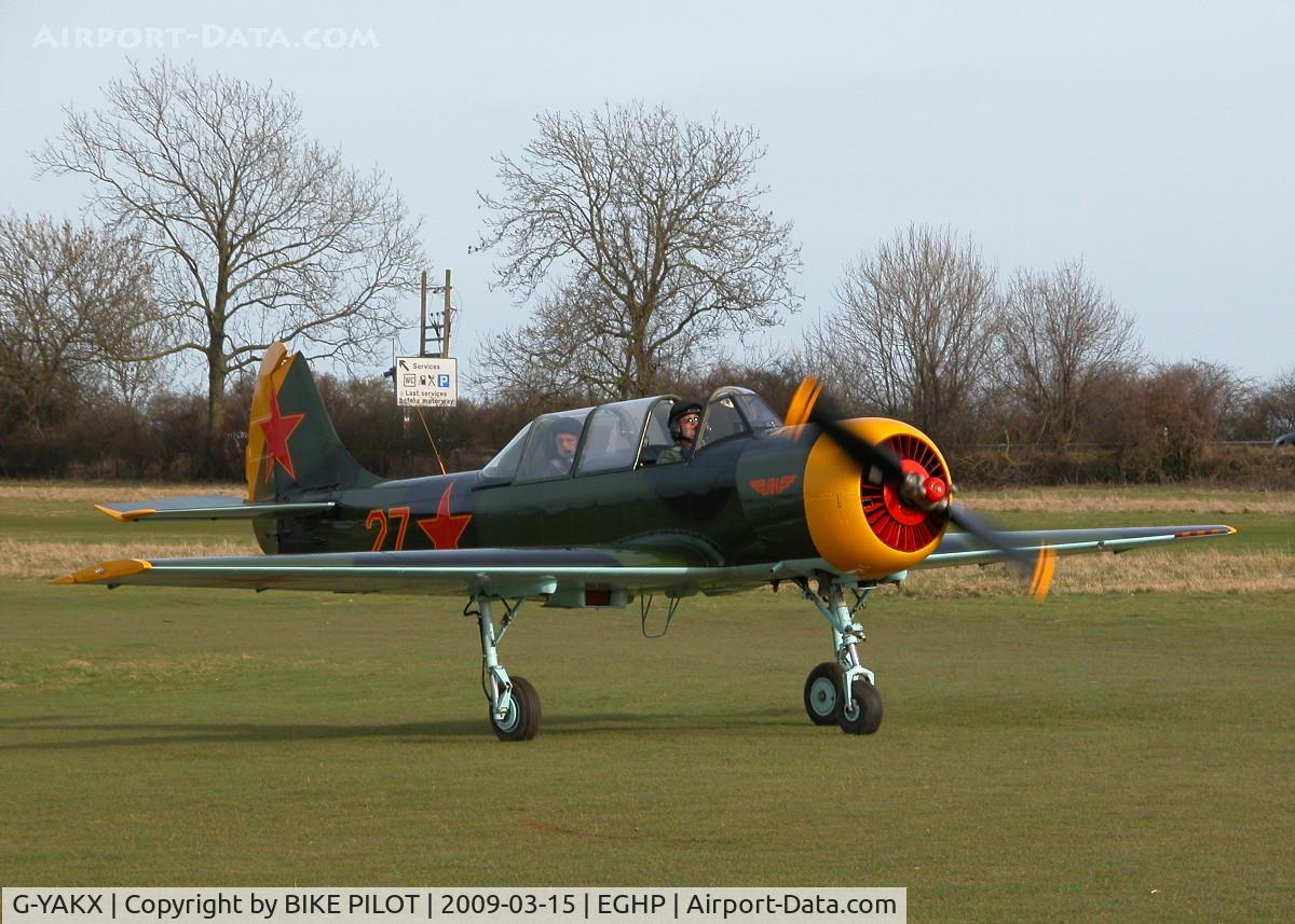 G-YAKX, 1991 Yakovlev (Aerostar) Yak-52 C/N 9111307, RESIDENT YAK TAXYING IN