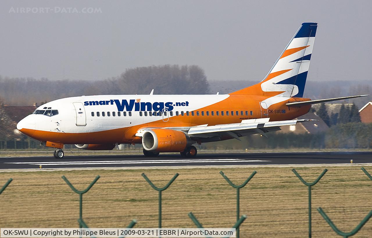 OK-SWU, 1993 Boeing 737-522 C/N 26703, One second after nose gear hit the tarmac of rwy 25L. Notice unusal whiite nose tip.