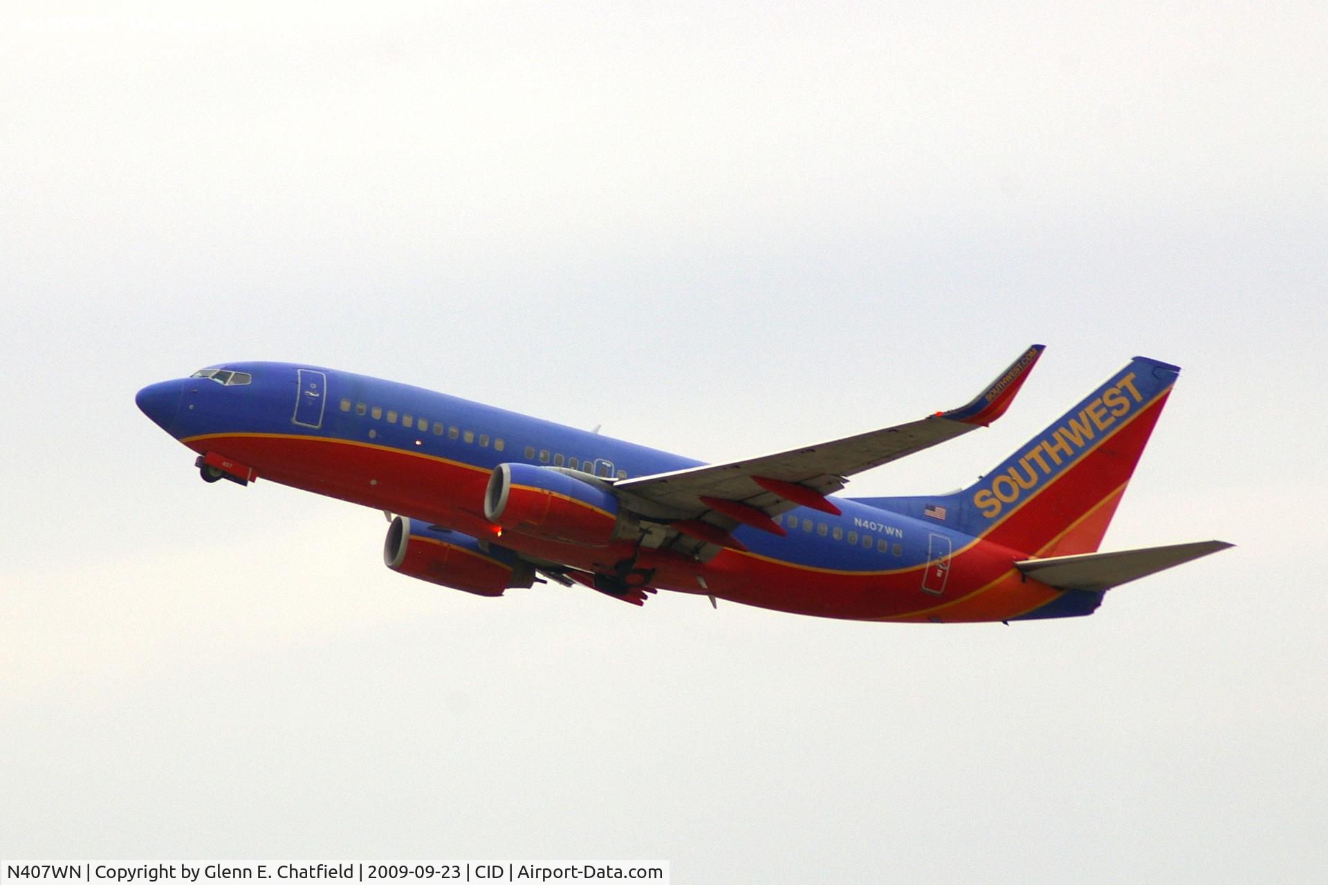 N407WN, 2001 Boeing 737-7H4 C/N 29817, Climbing out after departing runway 9.