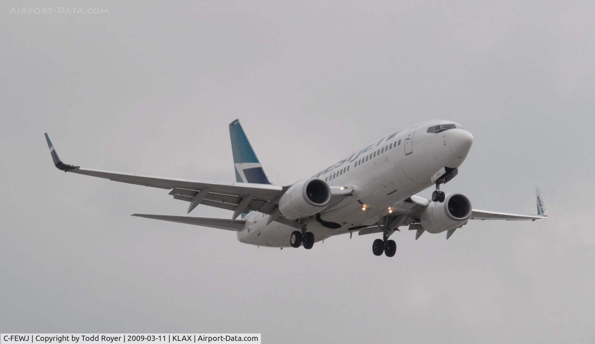 C-FEWJ, 2005 Boeing 737-7CT C/N 32769, Landing 24R at LAX