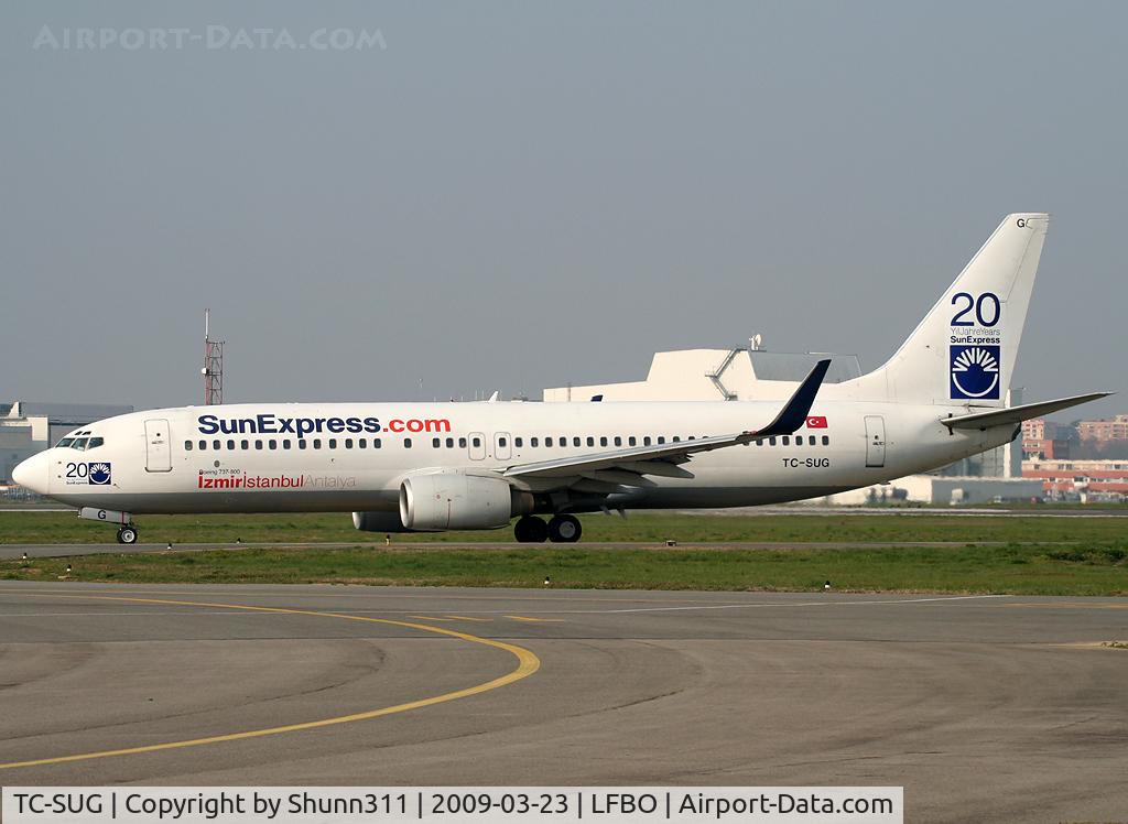 TC-SUG, 2002 Boeing 737-8CX C/N 32365, TAxiing holding point rwy 32R for departure... With 20 years stickers and 'Sunexpress.com' titles :)