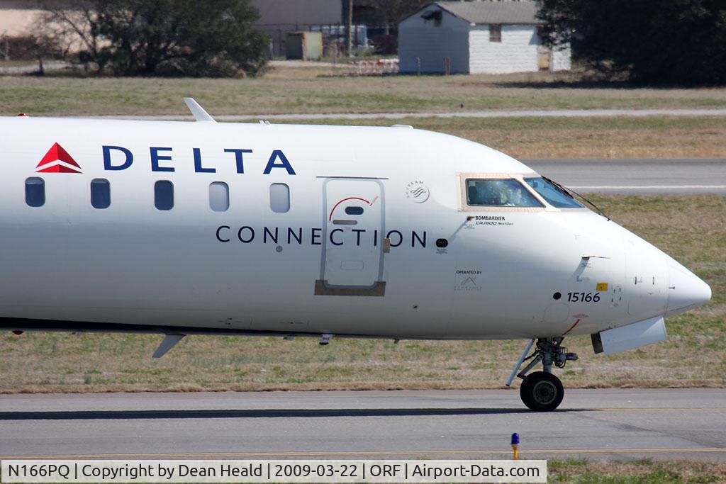 N166PQ, 2008 Bombardier CRJ-900ER (CL-600-2D24) C/N 15166, Close-up shot of the nose of Delta Connection (Pinnacle Airlines) N166PQ (FLT FLG5832) taxiing to the gate after arrival on RWY 5 from Hartsfield-Jackson Atlanta Int'l (KATL).