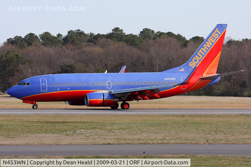 N453WN, 2004 Boeing 737-7H4 C/N 29847, Southwest Airlines N453WN (FLT SWA2828) rolling out on RWY 5 after arrival from Orlando Int'l (KMCO).