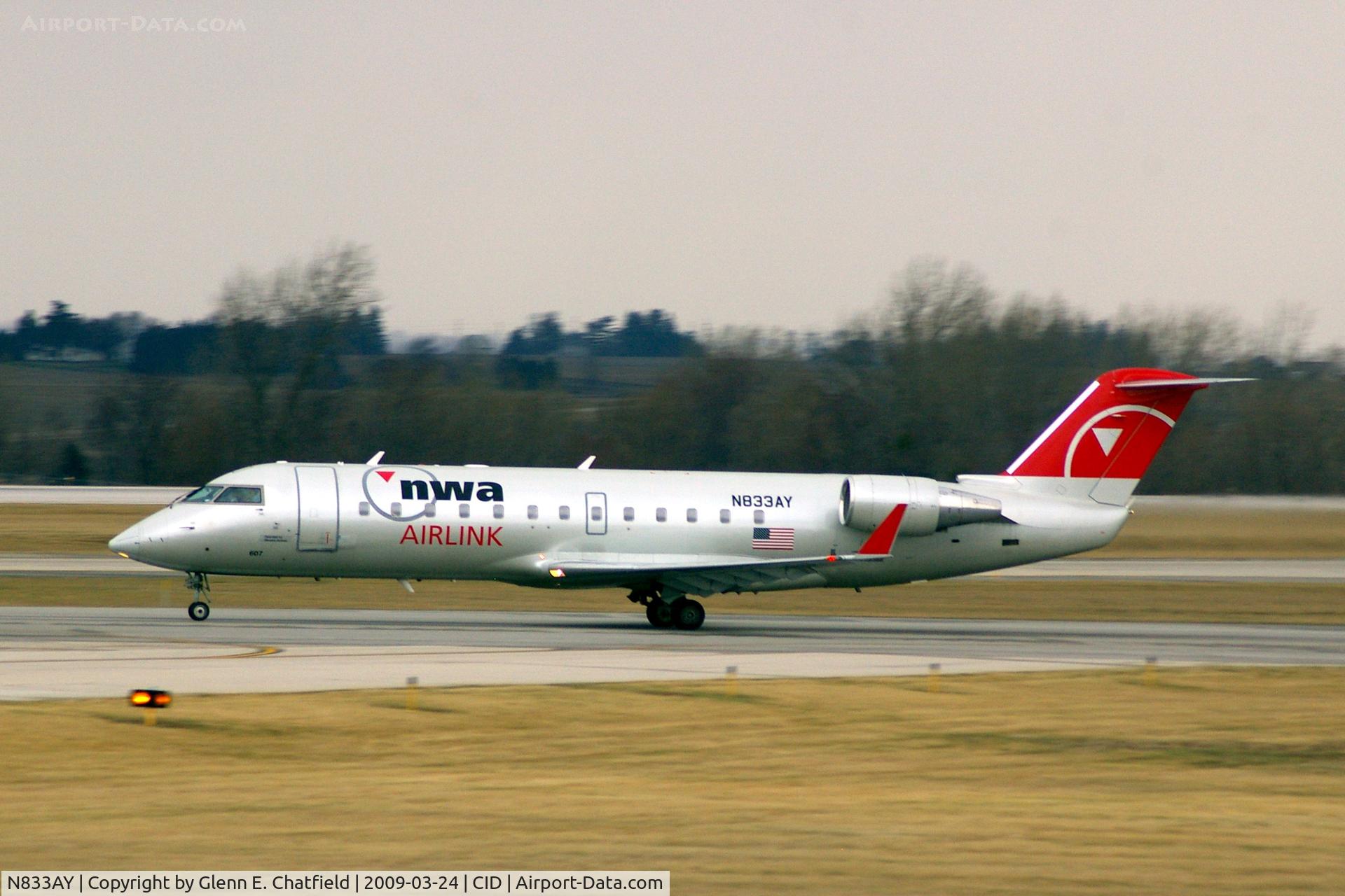 N833AY, 2005 Bombardier CRJ-200LR (CL-600-2B19) C/N 8033, Departing Runway 13 for CVG, light rain