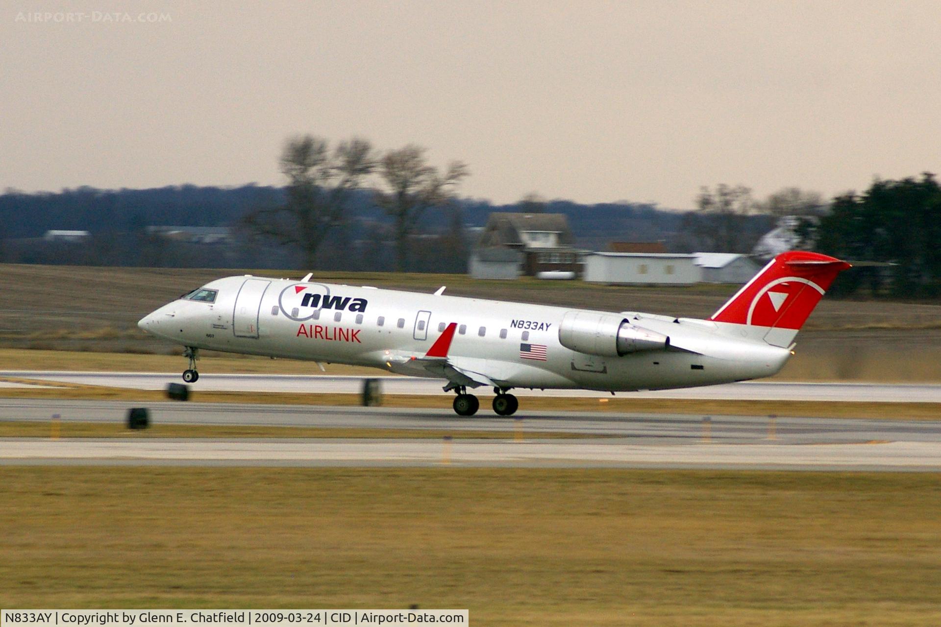 N833AY, 2005 Bombardier CRJ-200LR (CL-600-2B19) C/N 8033, Departing Runway 13 for CVG, light rain