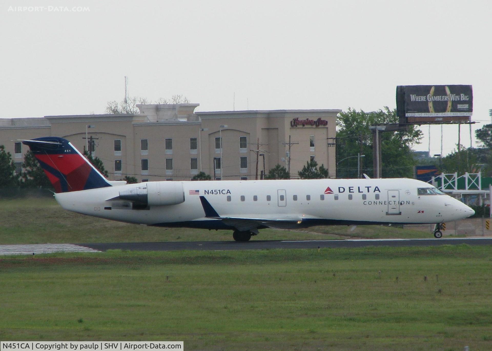 N451CA, 2001 Bombardier CRJ-200ER (CL-600-2B19) C/N 7562, Starting to roll on runway 14 for take off at the Shreveport Regional airport.
