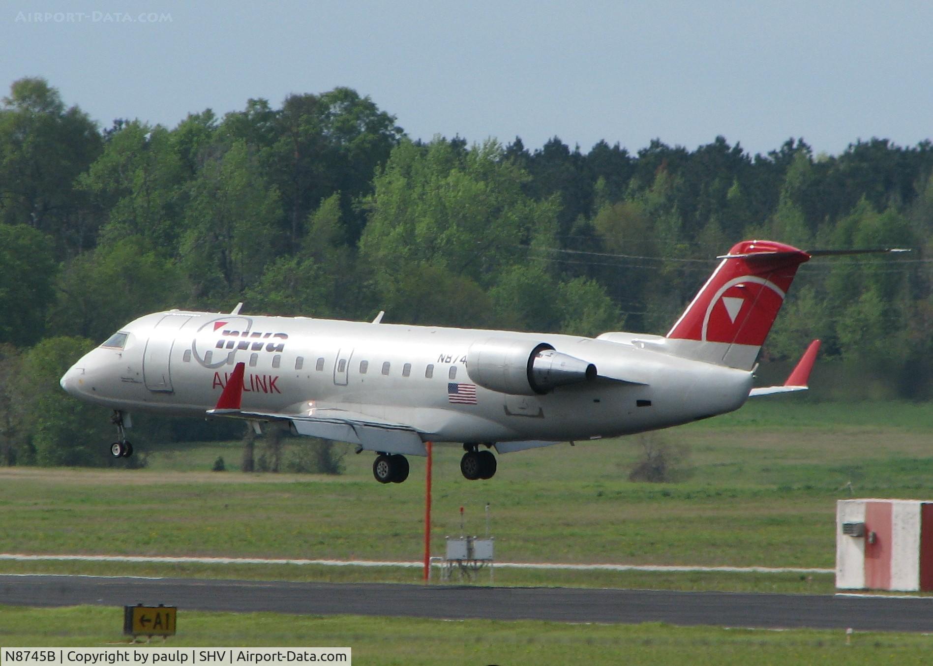 N8745B, 2003 Bombardier CRJ-200 (CL-600-2B19) C/N 7745, About to touch down on 14 at Shreveport Regional.