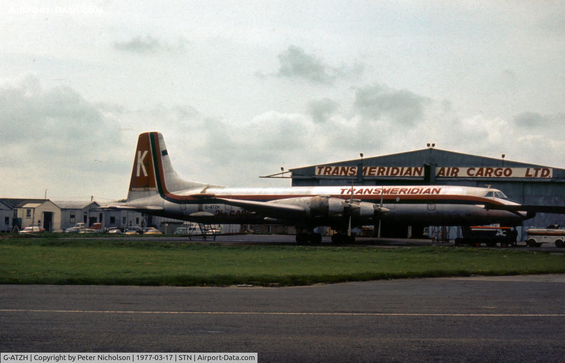 G-ATZH, 1961 Canadair CL-44D4-2 C/N 21, Transmeridian's CL-44 at their base at London Stansted in the Spring of 1977.