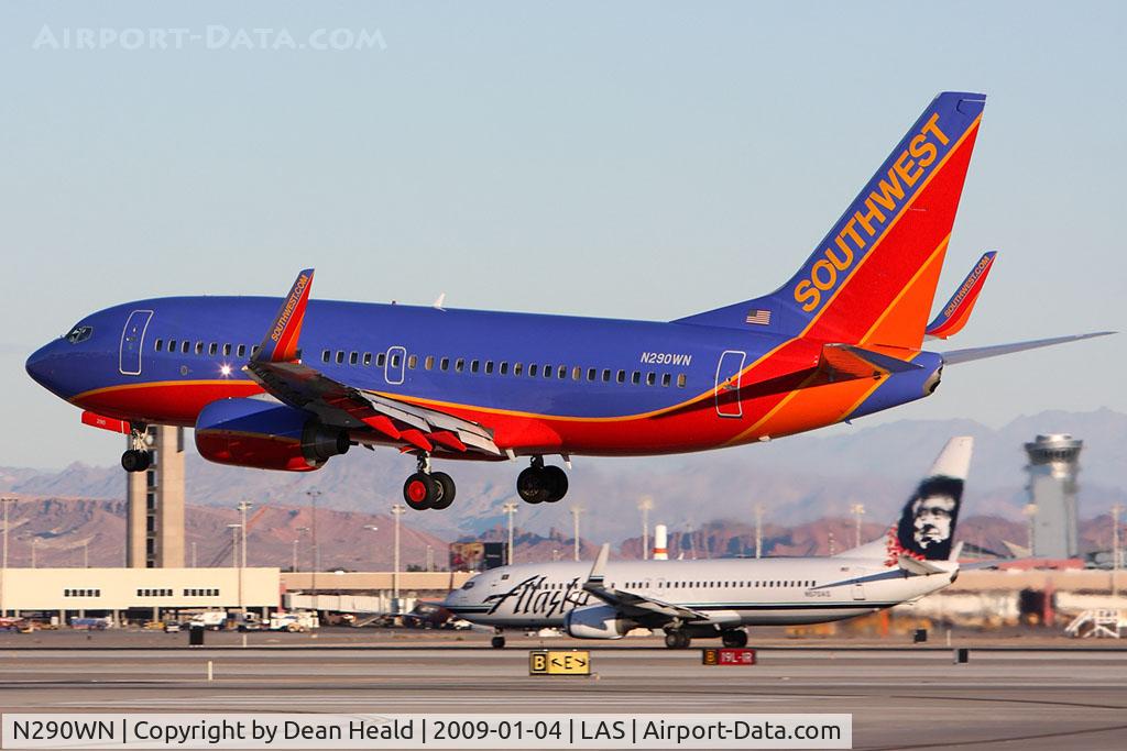 N290WN, 2007 Boeing 737-7H4 C/N 36632, Southwest Airlines N290WN (FLT SWA2590) from Los Angeles Int'l (KLAX) landing on RWY 1L while Alaska Airlines N570AS is starting takeoff roll on RWY 1R.