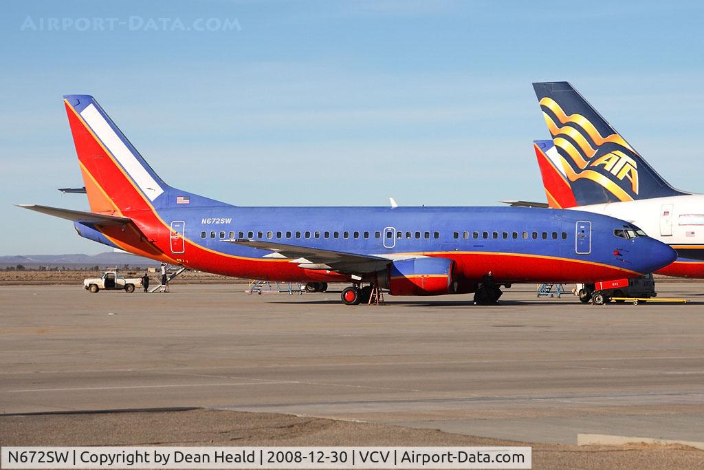 N672SW, 1986 Boeing 737-3Q8 C/N 23406, Sad Sight...Southwest Airlines N672SW was recently removed from service and flown to Victorville for storage. The ATA 757 has it's reg blocked and the other Southwest 733 in the background is unidentifiable from this angle.
