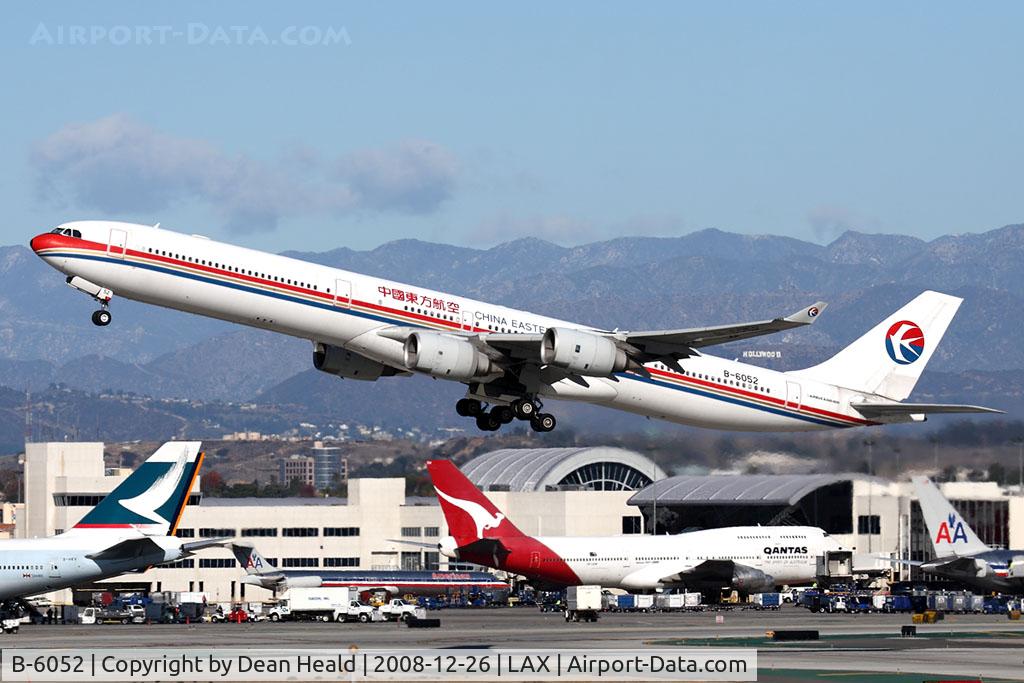 B-6052, 2003 Airbus A340-642 C/N 514, China Eastern Airlines B-6052 (FLT CES586) climbing out from RWY 25R enroute to Shanghai Pudong (ZSPD). You won't be seeing that Qantas 743 much longer. She is scheduled to be removed from service soon.