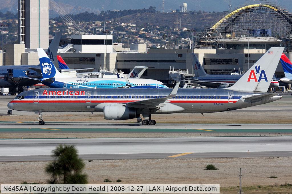 N645AA, 1991 Boeing 757-223 C/N 24603, American Airlines N645AA (FLT AAL25) holding short of RWY 25R after arrival on RWY 25L from Boston Logan Int'l (KBOS). In the background, the Alaska Airlines 