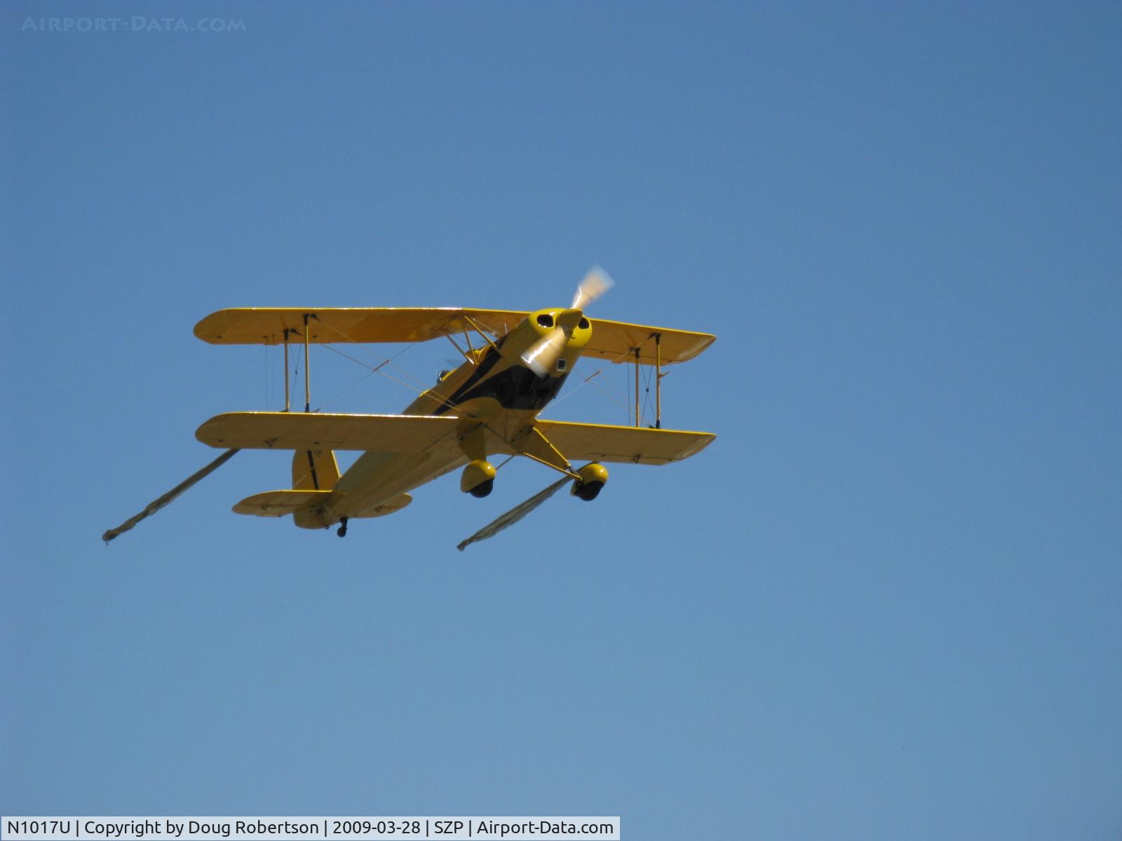 N1017U, 1939 CASA 1-131 Jungmann C/N E3B-435, 1939 Bucker Jungmann C.A.S.A. 1.131, Lycoming O-360 180 Hp upgrade, takeoff climb Rwy 22 with streamers