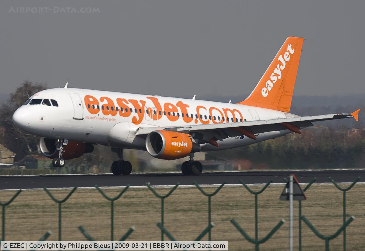 G-EZEG, 2004 Airbus A319-111 C/N 2181, Landing on rw 25L, nose still up.
