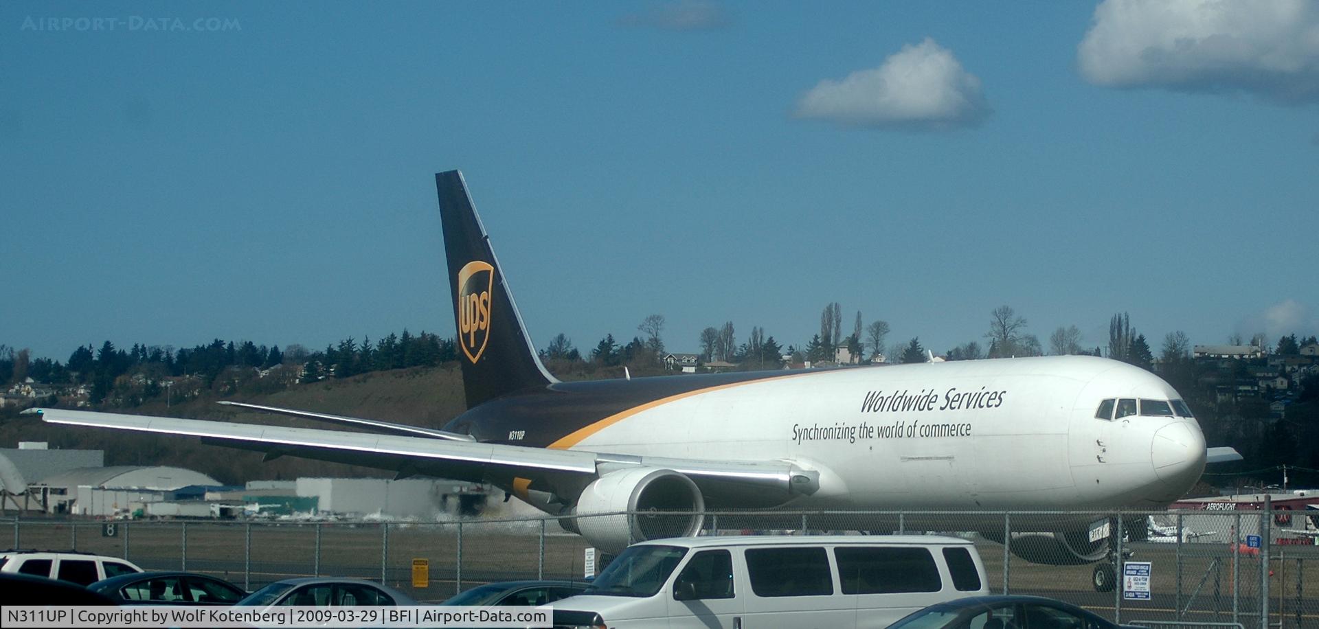 N311UP, 1996 Boeing 767-34AF C/N 27741, on taxiway for take-off on 31L, at BOEING field, in Seattle