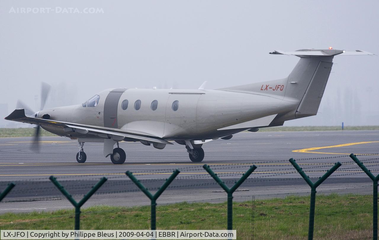 LX-JFO, 2007 Socata TBM-850 C/N 422, Suddenly coming out off the genarl aviation apron by a misty morning.