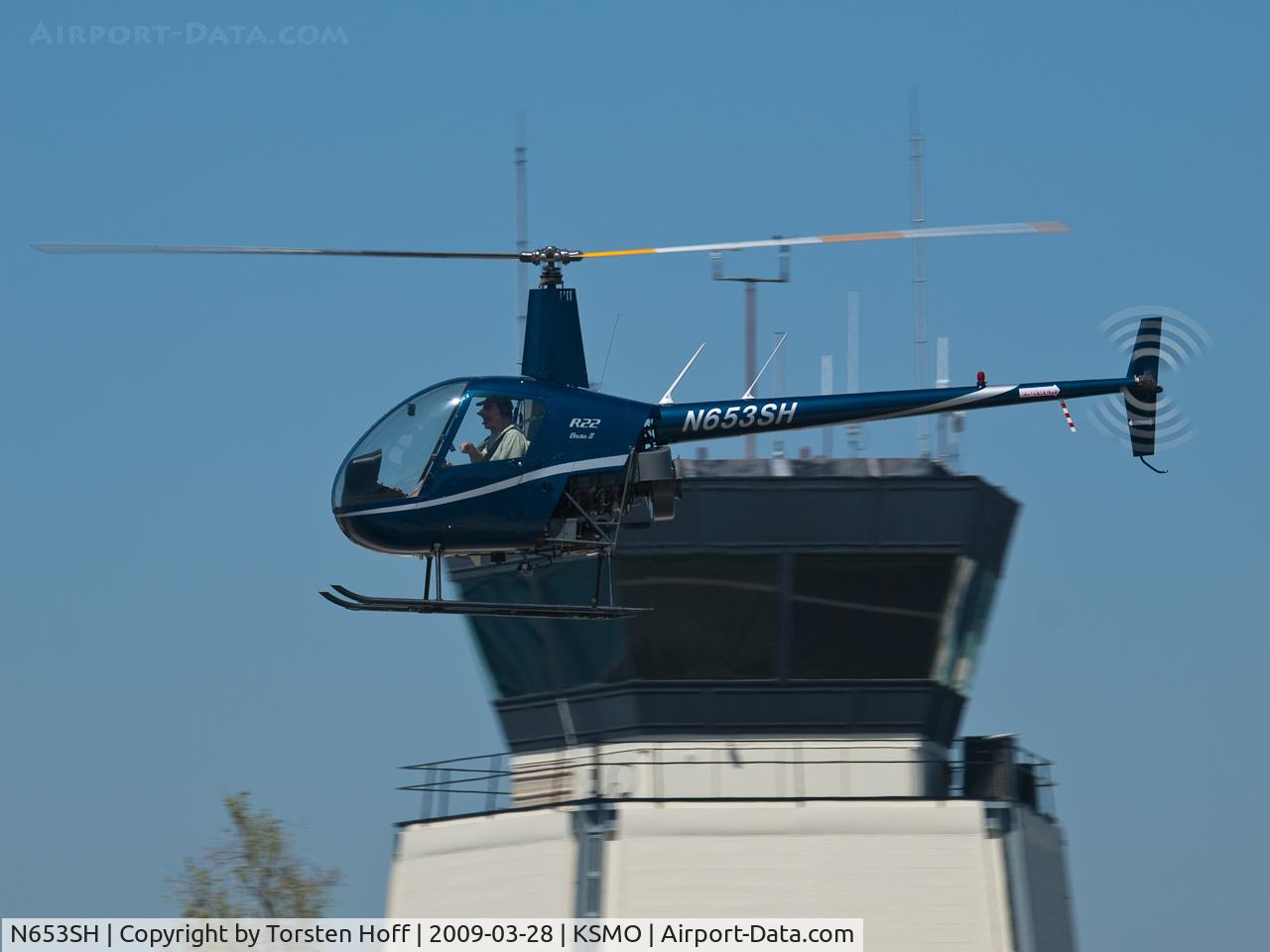 N653SH, 2003 Robinson R22 Beta C/N 3504, N653SH in front of KSMO's tower