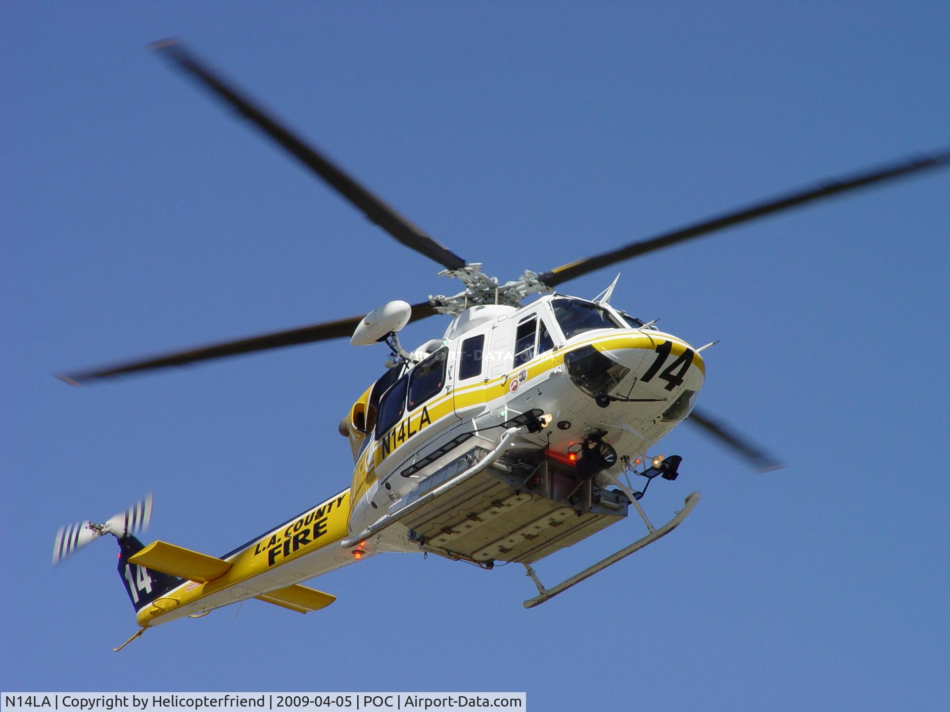 N14LA, 2005 Bell 412EP C/N 36393, Passing by Ranger Row getting ready to flare and enter the EHA helipad