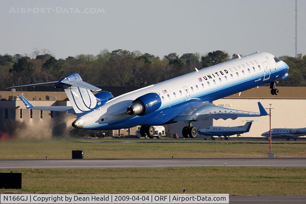 N166GJ, 2008 Bombardier CRJ-702 (CL-600-2C10) Regional Jet C/N 10266, United Express (Go Jet Airlines) N166GJ (FLT GJS7471) departing RWY 23 enroute to Chicago O'Hare Int'l (KORD). You can see a nice reflection of the fuselage on the right wing of this new CRJ700.