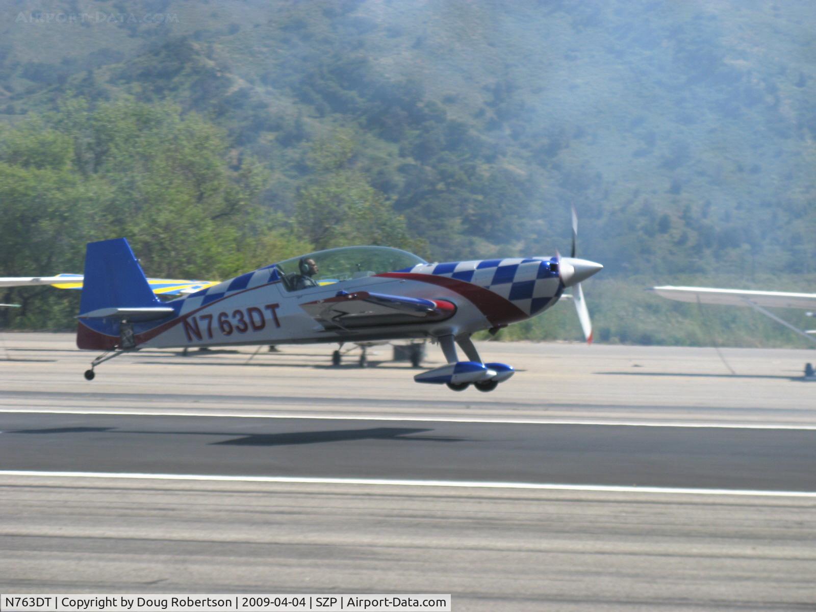 N763DT, 2007 Extra EA-300/L C/N 1258, 2007 Extra Flugzeugproduktions EXTRA EA 300L, Lycoming AEIO-540-L1B5 300 Hp, takeoff climb Rwy 22 through dissipating airshow smoke from N64SH