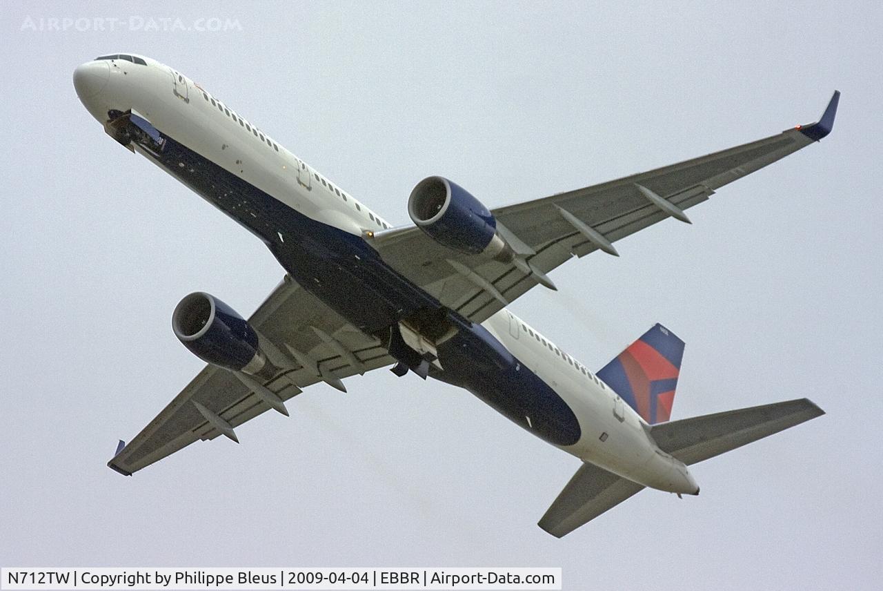 N712TW, 1997 Boeing 757-2Q8 C/N 27624, Wingleted -757 (ex-AA) climbing through the Brussels morning gloom.