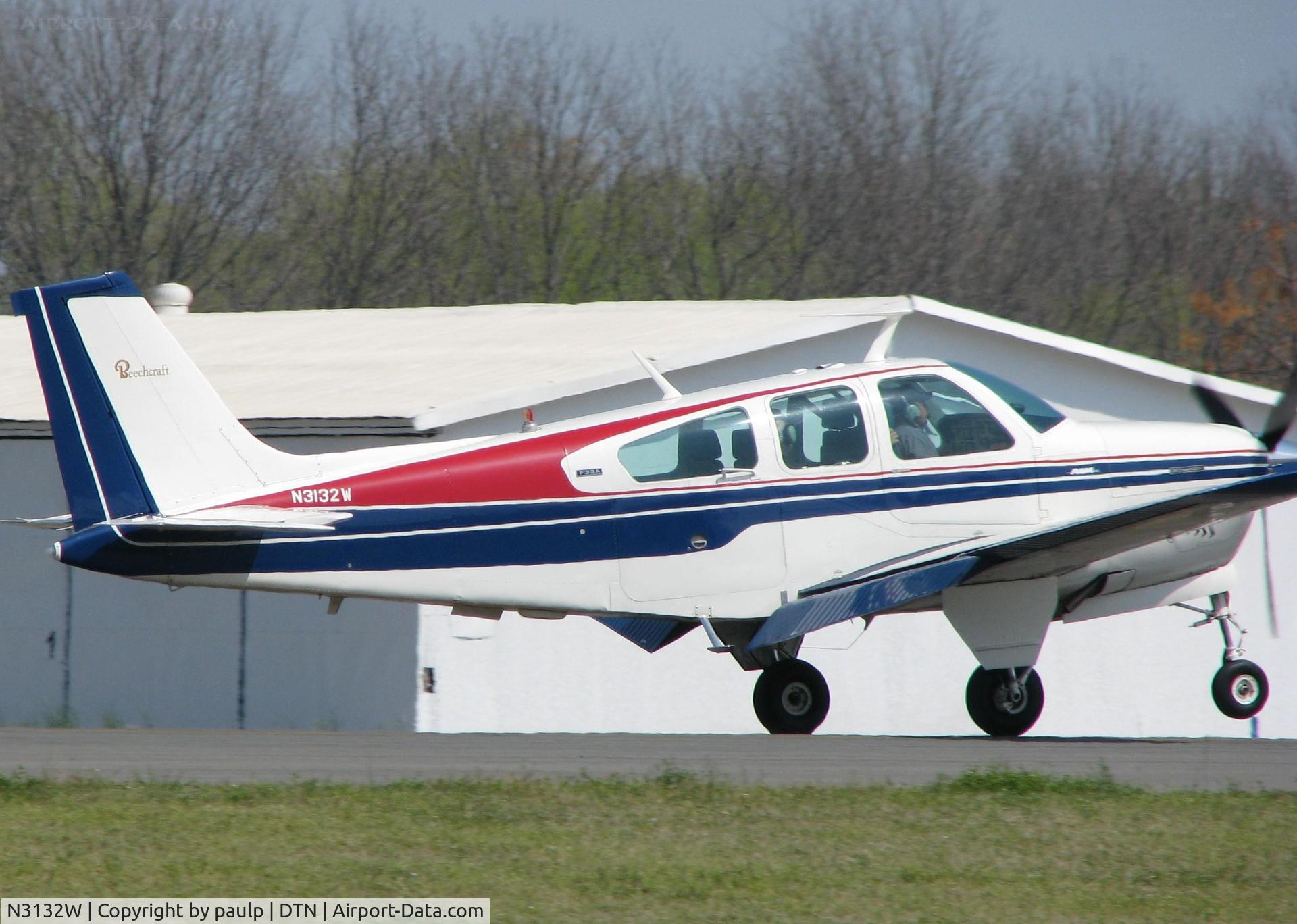 N3132W, 1973 Beech F33A Bonanza C/N CE-477, Front wheel about to touch down on runway 14 at Downtown Shreveport.