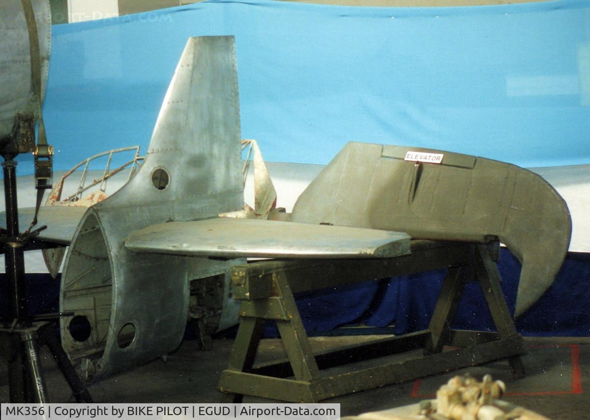 MK356, 1944 Supermarine 361 Spitfire LF.IXc C/N CBAF.IX.1561, TAIL SECTION WITH PARTIALLY STRIPED ELEVATOR.RAF ABINGDON EARLY 90'S
