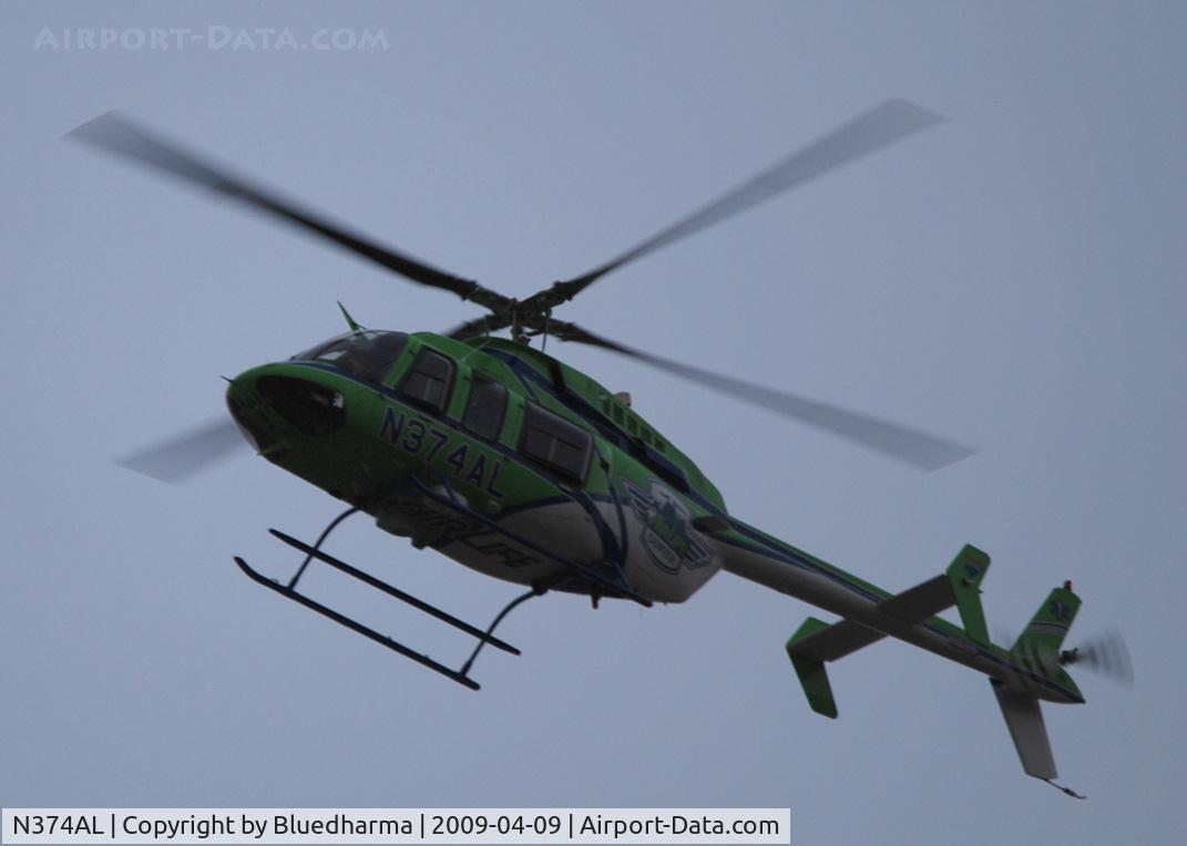 N374AL, 2008 Bell 407 C/N 53819, Flying over Columbine High School Littleton, Colorado