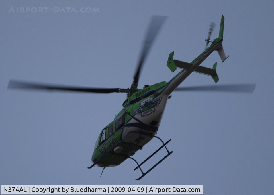 N374AL, 2008 Bell 407 C/N 53819, Flying over Columbine High School Littleton, Colorado