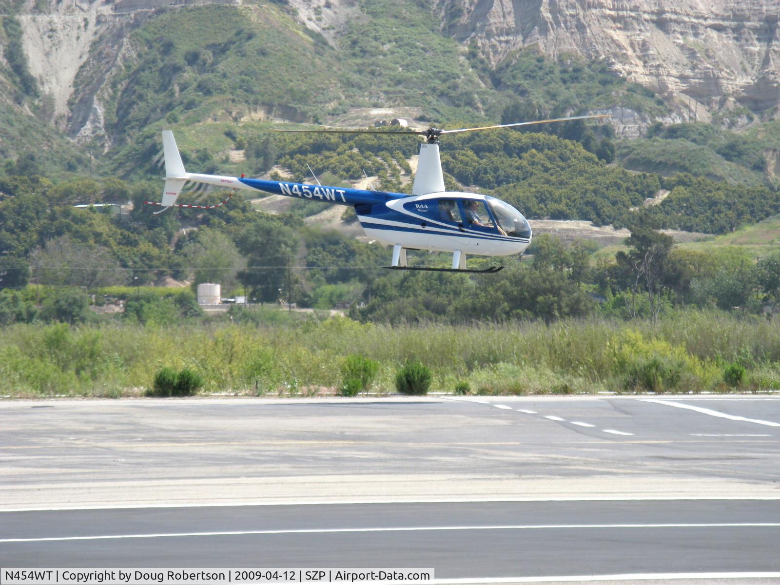N454WT, 2001 Robinson R44 Raven II C/N 1042, 2001 Robinson R44 RAVEN, Lycoming O-540-F1B5 260 Hp derated, safety hover before crossing Rwy 22