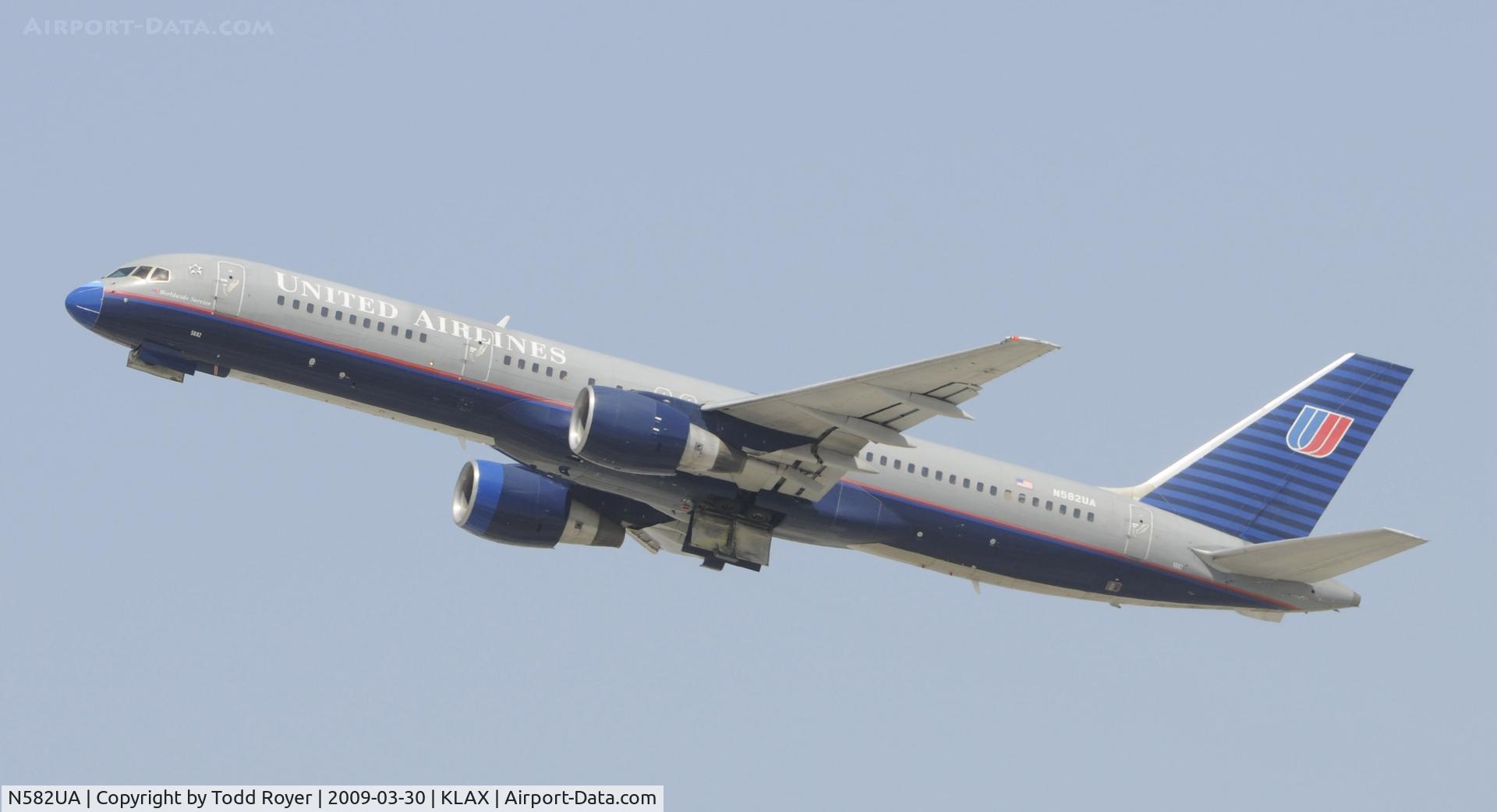 N582UA, 1993 Boeing 757-222 C/N 26702, Departing LAX on 25R