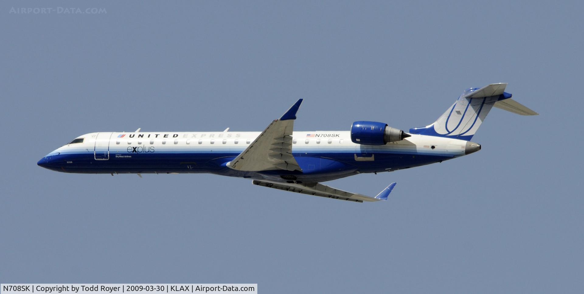 N708SK, 2004 Bombardier CRJ-701ER (CL-600-2C10) Regional Jet C/N 10156, Departing LAX on 25R