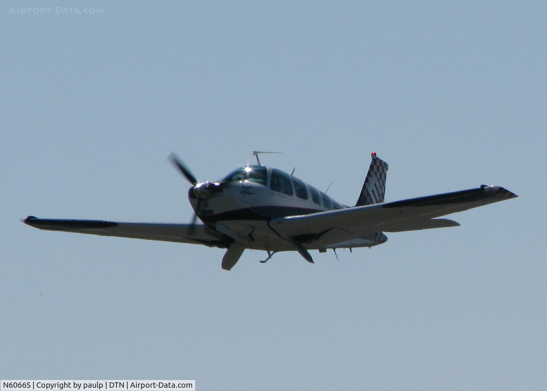 N6066S, 1975 Beech A36 Bonanza 36 C/N E-774, Off of 32 at the Shreveport Downtown airport. This Bonanza is taking off with the Greg Poe MX2. I think this is the crew/support aircraft? They have some of the same markings.