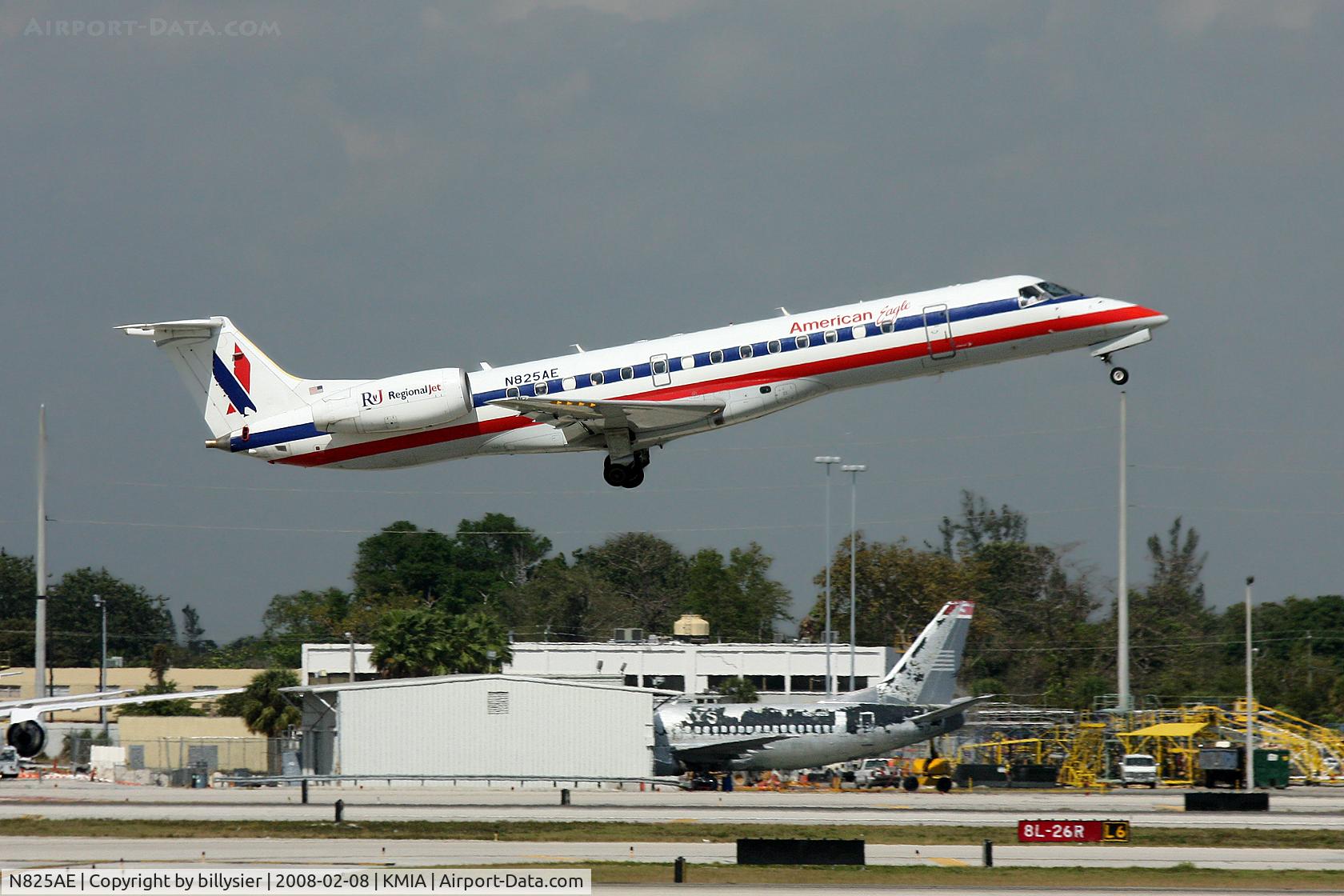 N825AE, 2002 Embraer ERJ-140LR (EMB-135KL) C/N 145589, Take-off. Note the 737 stripped of paint in the background.