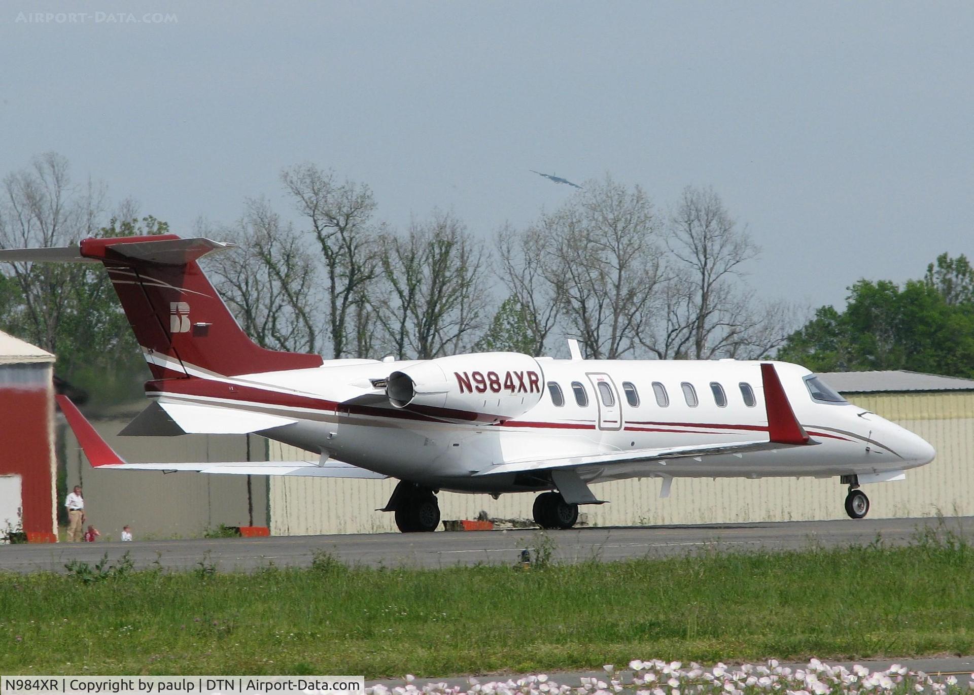 N984XR, 2008 Learjet Inc 45 C/N 373, Rolling down 14 for take off from the Shreveport Downtown airport. Also a B-52H from Barksdale Air Force Base in the background.