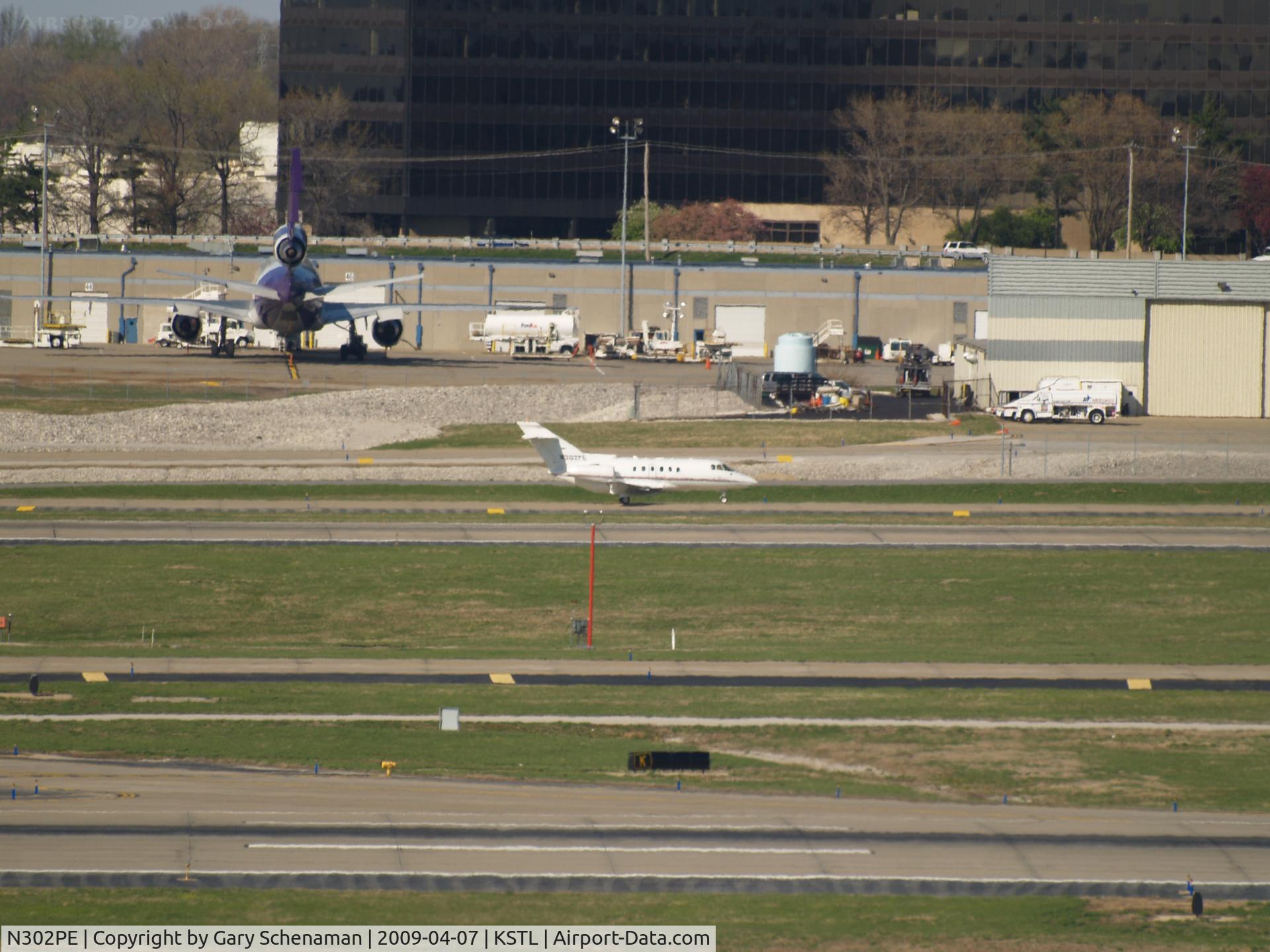 N302PE, 2004 Raytheon Hawker 800XP C/N 258693, JUST LANDED AND HEADING TOWARD TERMINAL