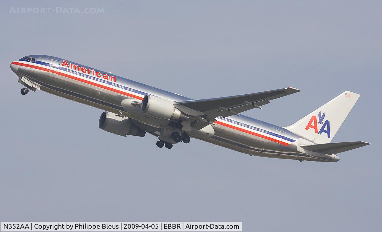 N352AA, 1988 Boeing 767-323ER C/N 24033, Climbing rwy heading from rwy 25R, gear on the move.