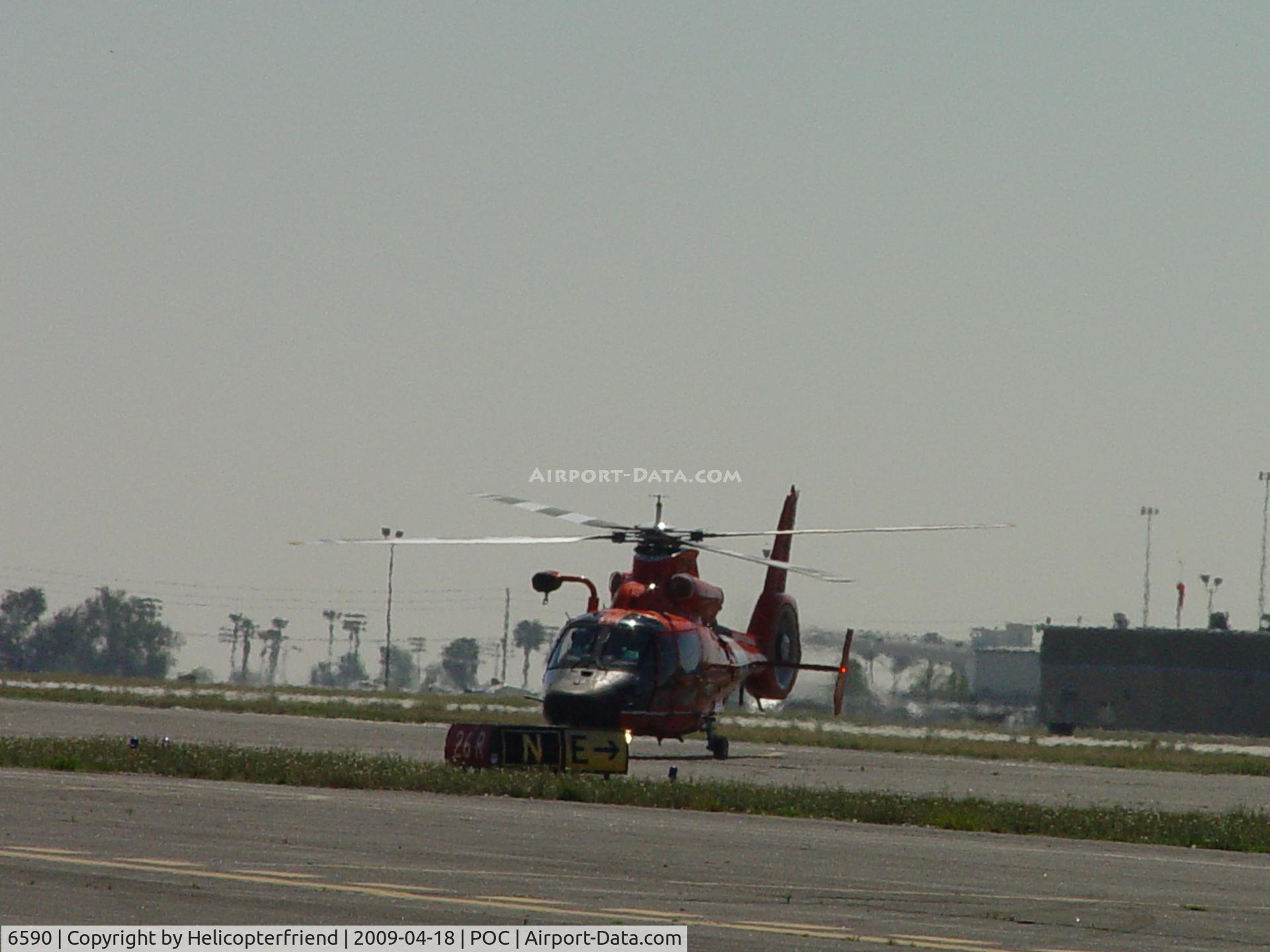 6590, Aerospatiale HH-65A Dolphin C/N 6291, USCG Dolphin HH 65C taxiing to the northside transient parking