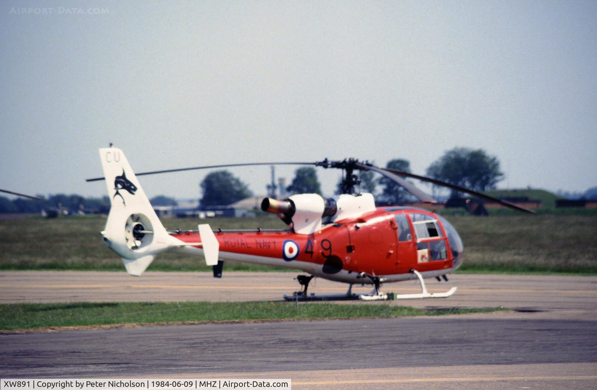 XW891, 1974 Westland SA-341C Gazelle HT2 C/N 1163, Gazelle HT.2 of The Sharks aerobatic display team flown by 705 Squadron at the 1984 RAF Mildenhall Air Fete.