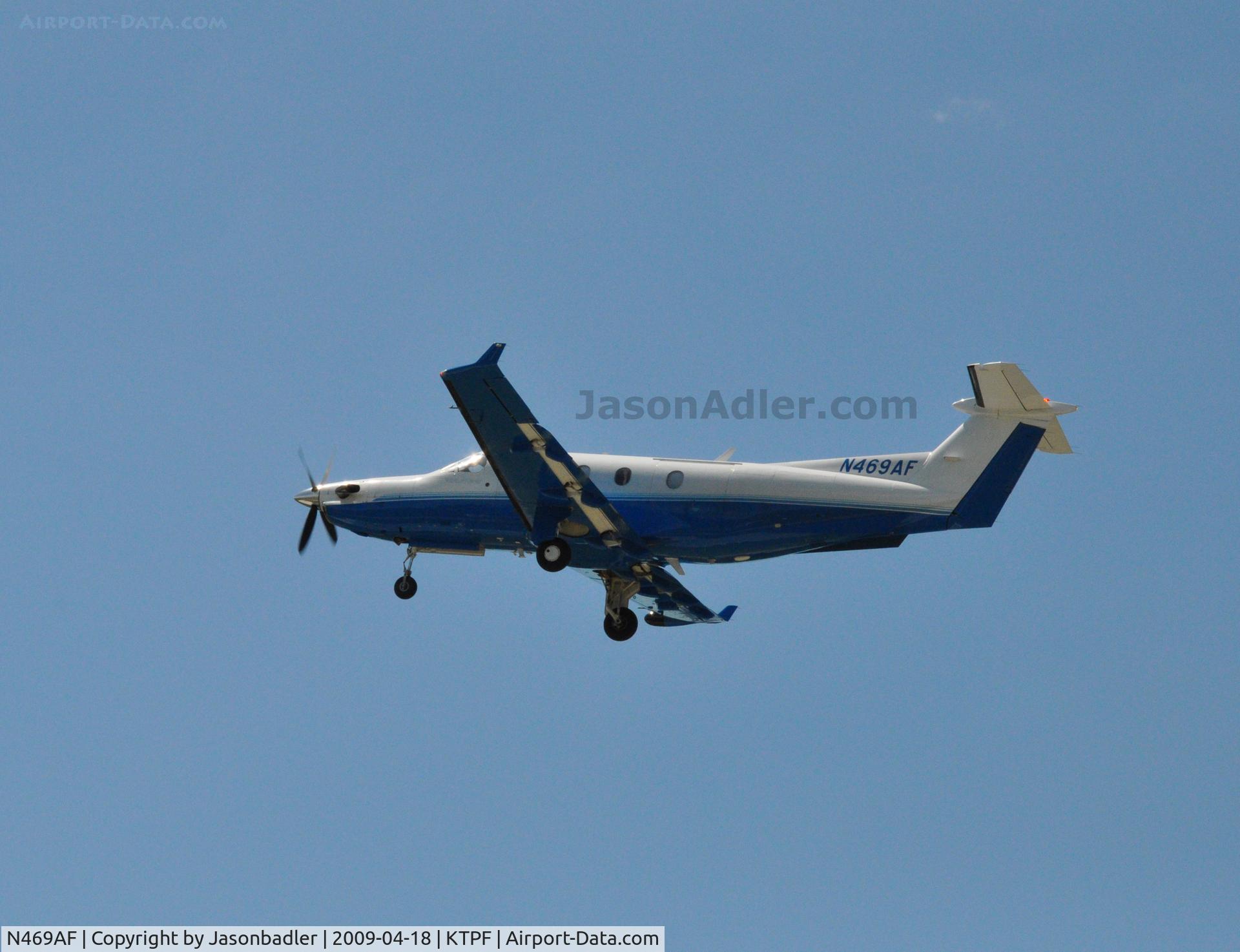 N469AF, 2002 Pilatus PC-12/45 C/N 469, This photo was take at Peter O Knight airport during Island Fest 2009. The plane was departing around 4 PM