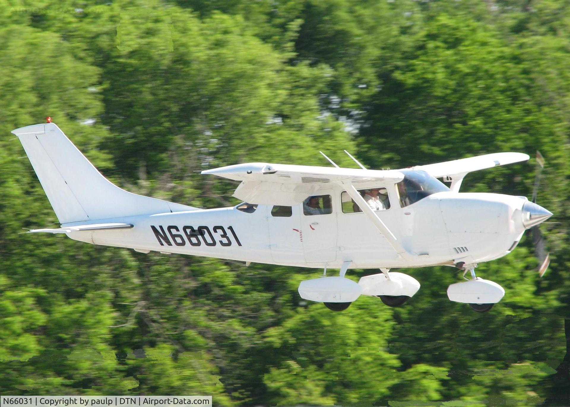 N66031, 2005 Cessna T206H Turbo Stationair C/N T20608512, About to touch down on runway 14 at the Shreveport Downtown airport.