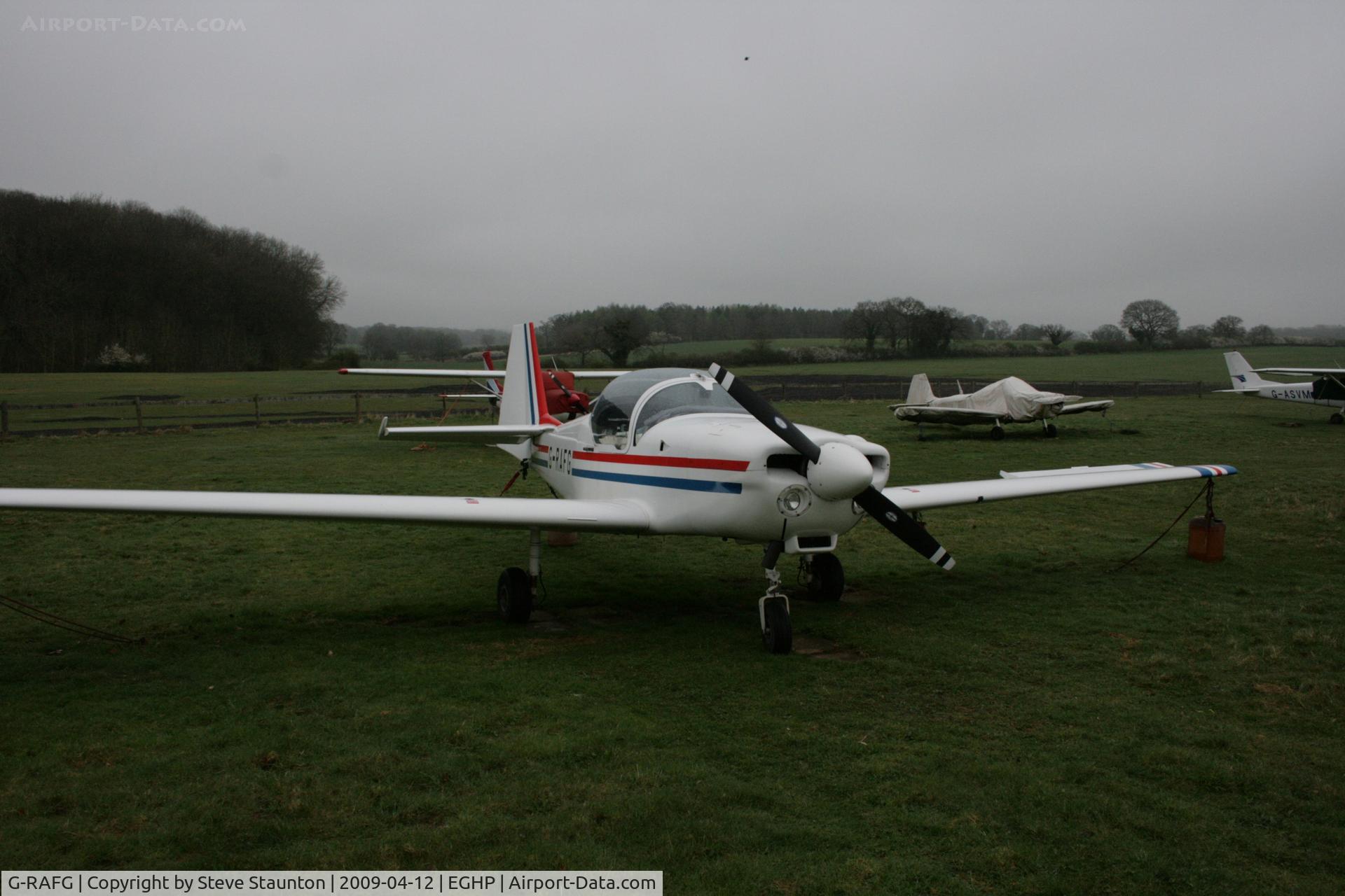 G-RAFG, 1989 Slingsby T-67C Firefly C/N 2076, Taken at Popham Airfield, England on a gloomy April Sunday (12/04/09)
