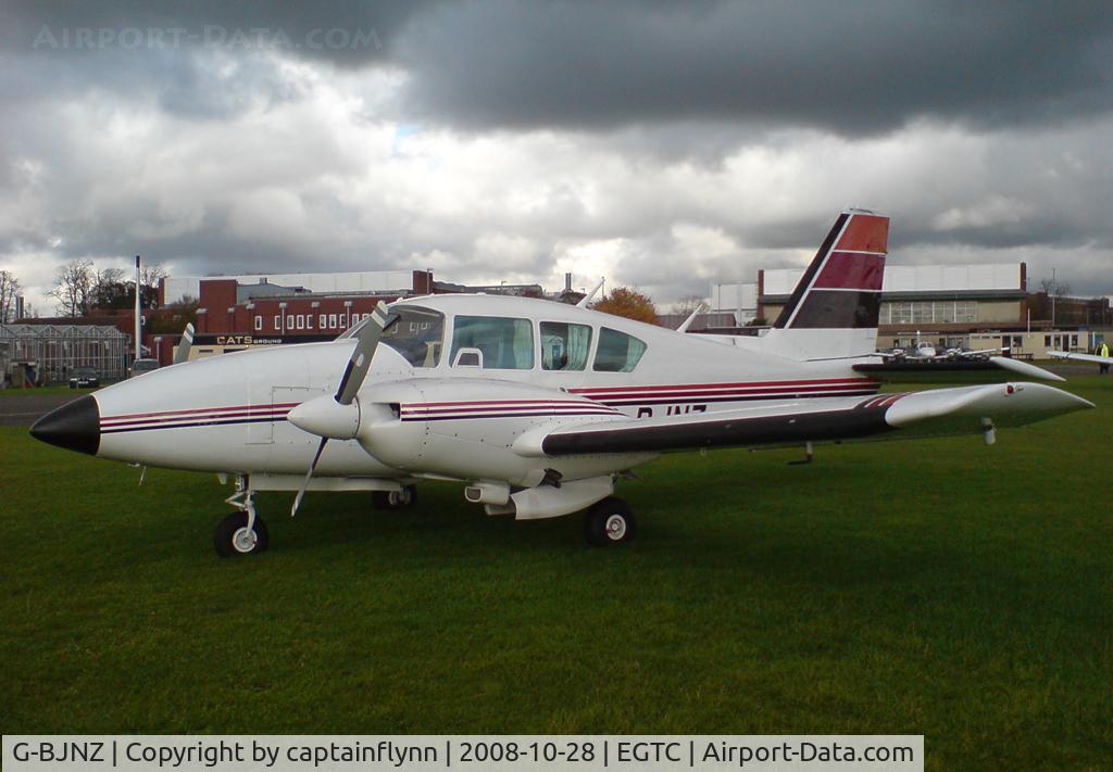 G-BJNZ, 1979 Piper PA-23-250 Aztec C/N 27-7954099, Belongs to Bonus Aviation. Snow clouds gather in the background.